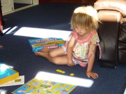 Sophie playing Scrabble