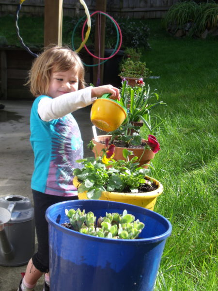 Sophie taking care of her plants