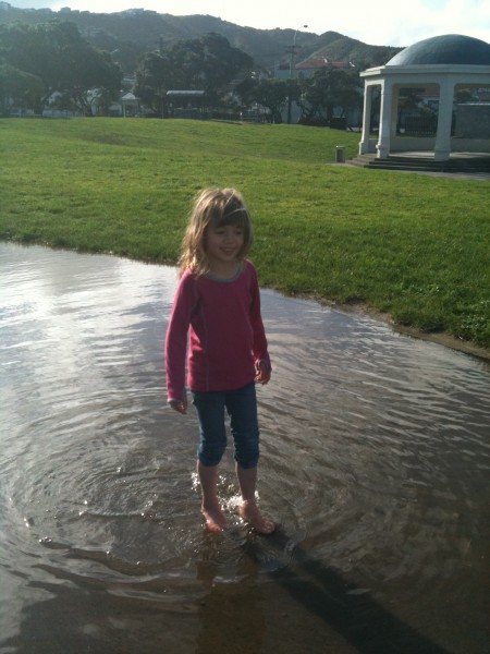 Charlotte wading through a giant puddle at Island Bay Charlotte wading through a giant puddle at Island Bay