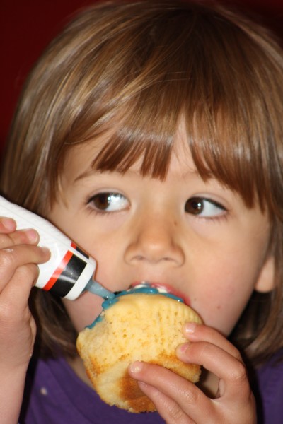 Sophie couldn't get enough icing on her cupcake!