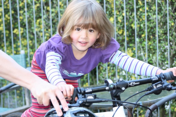 Sophie tries Daddy's bike for size!