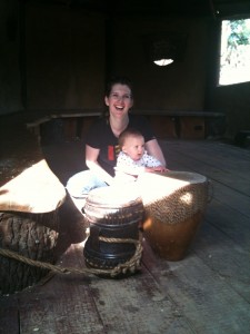 Alice drumming in the African village at Welly Zoo