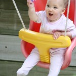 Yee haa in the swing Alice 8 months