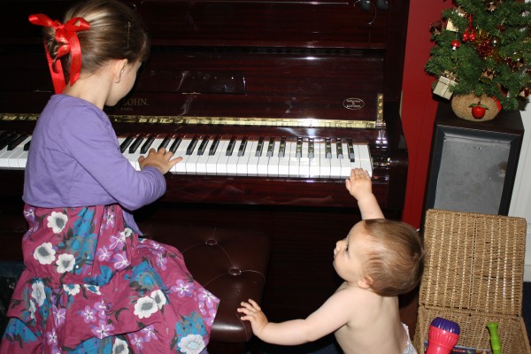 Charlotte playing the piano for Alice