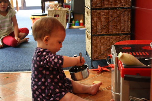 Alice at the toy kitchen