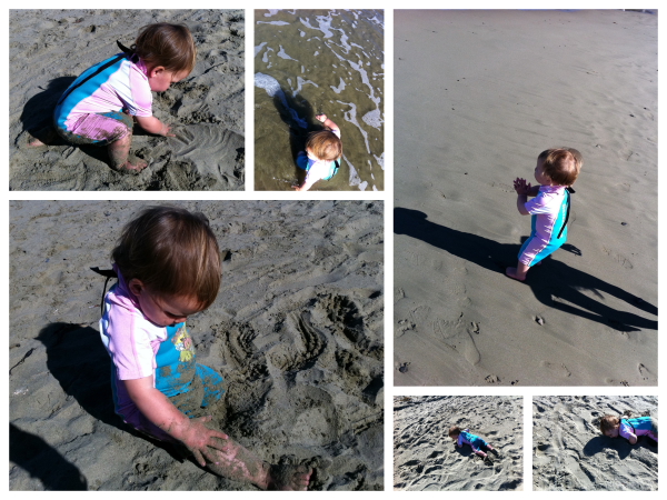 Alice rolling in the sand and running for the waves