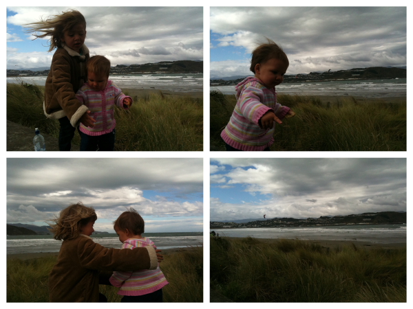 Alice & Sophie watching the kite surfers at Lyall Bay