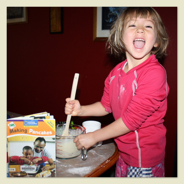 Sophie, age 5, baking pancakes for her Daddy