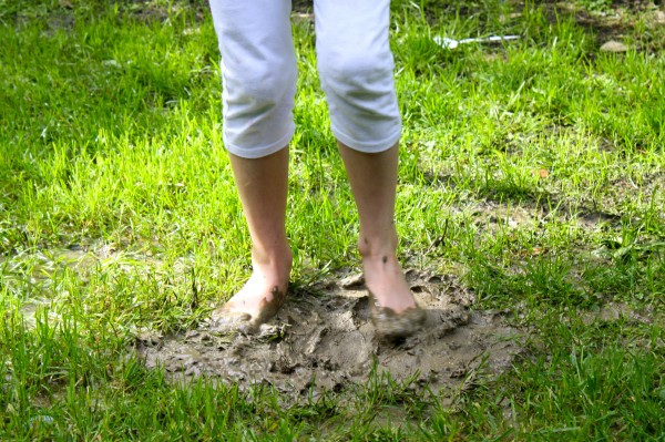 Charlotte delighting in mud