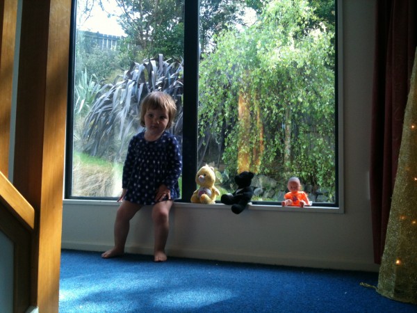 Alice lining up her friends on the windowsill