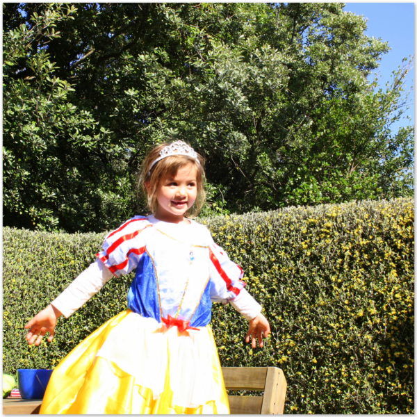 Sophie dressed as Snow White waiting for the party guests to arrive