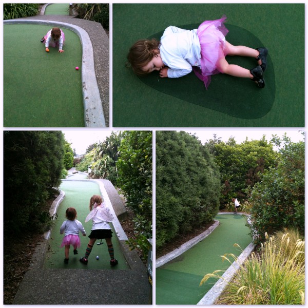 Alice & Sophie playing mini-golf