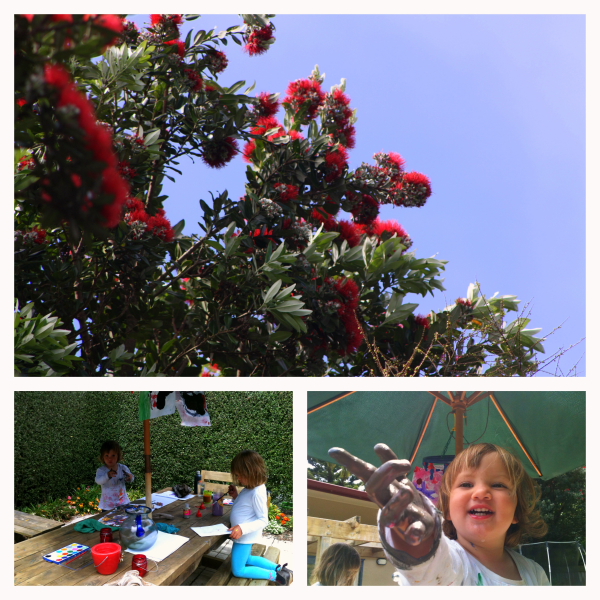 Painting fun in the garden with the beautiful glow of the Pohutukawa blooms.