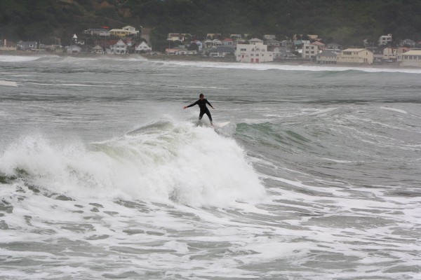 Big swells washing in on a high tide into Lyall Bay