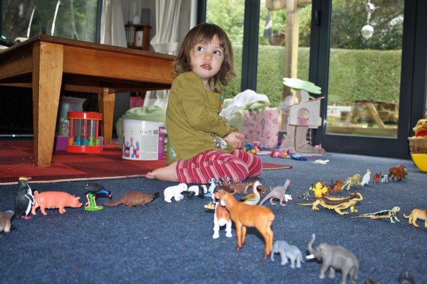 Alice playing a game with big sister Charlotte & the animals