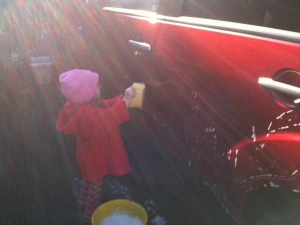 Alice washing the car