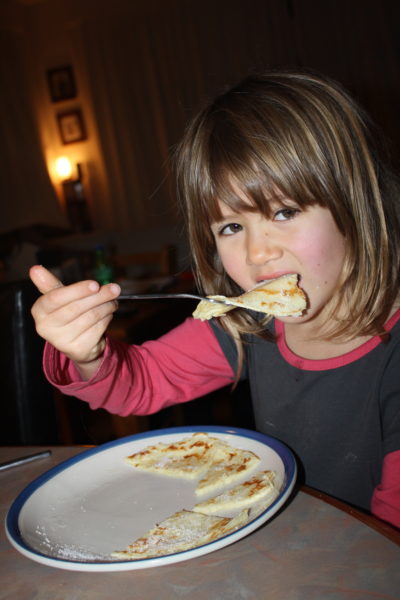 Sophie enjoying pancakes for supper