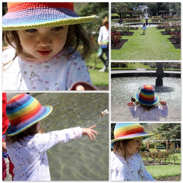 Alice and her rainbow hat at the rose gardens feeding the ducks, Wellington