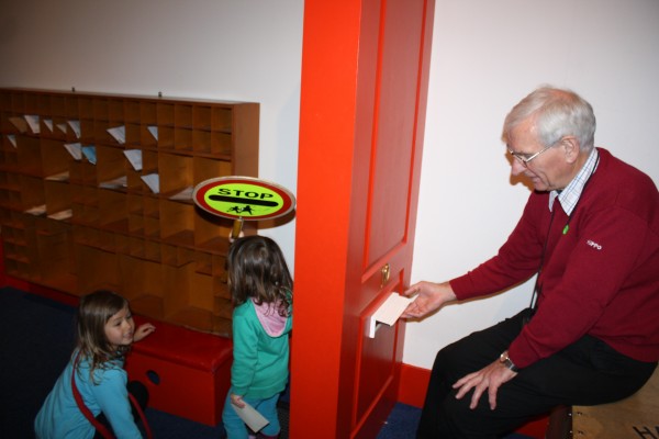 Granddad, Alice and Sophie playing at posties