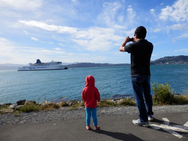 Here comes the ferry! Alice and Daddy waiting for it to dock in Wellington.