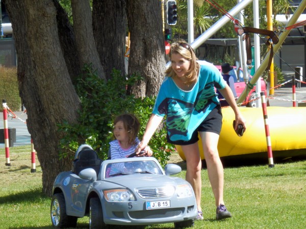 Alice driving a sports car!