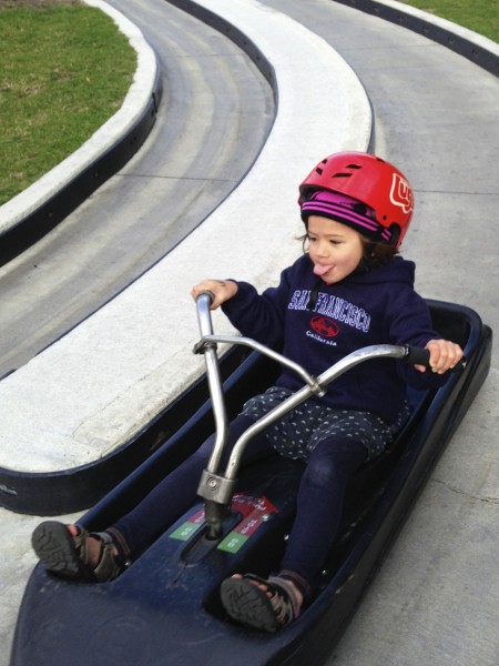 Sophie doing a Lightening McQueen expression on the Luge