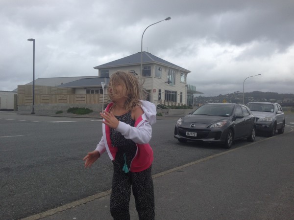 running in the wind with the Spruce Goose in the background