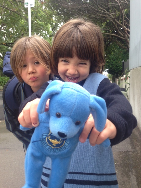 Alice and her school mascot puppy, along with one of her sisters!