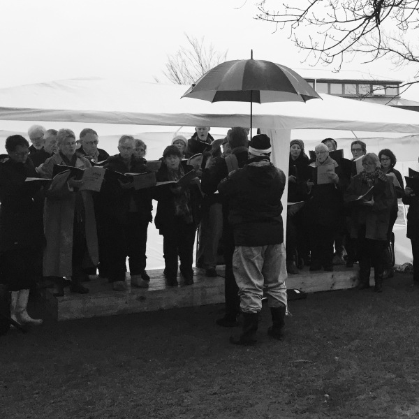 That's the spirit! The wonderful choir at Martinborough's Mid-Winter Affair, singing through the rain showers.
