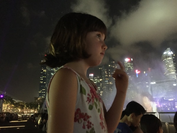 Alice watching the laser light show at Marina Bay Waterfront Promenade