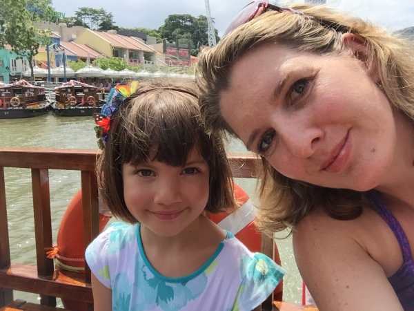 Alice and I on a 'bumboat' cruising along the Singapore River.