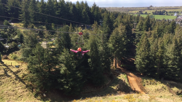 Sophie whizzing down on the zip-line.
