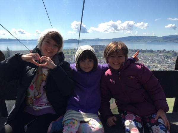 Sisters, Charlotte, Alice & Sophie riding up the Skyline gondola in Rotorua.