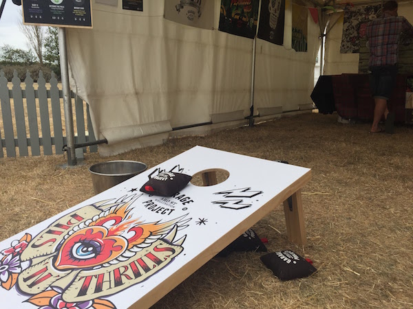 Corn hole game at Garage Project stand.