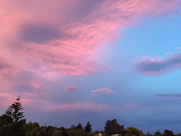 Clouds bathed in reflective light.