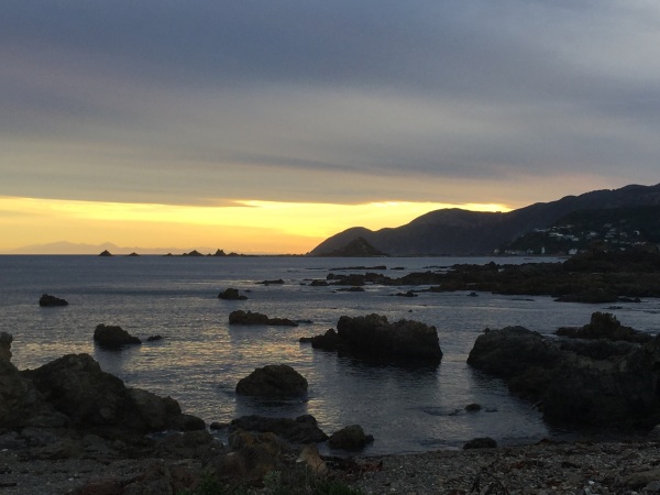 Sunset on Wellington's south coast, looking toward the South Island.