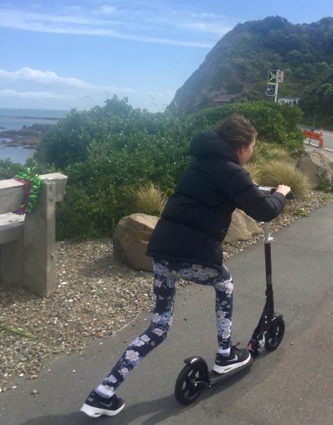 My oldest daughter whizzing along the bays on Wellington's south coast.