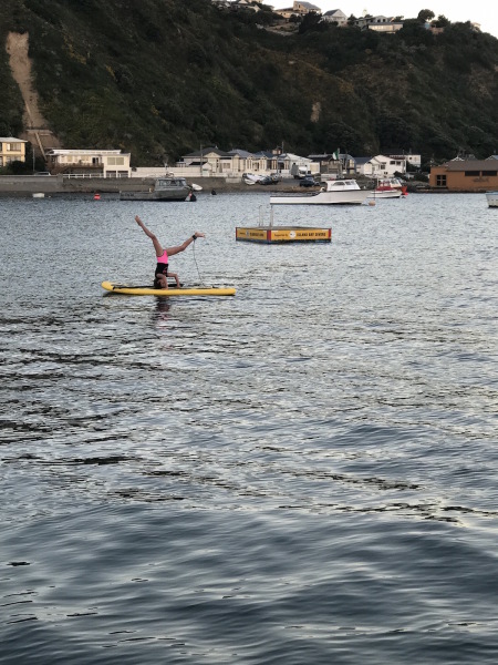 Sophie doing some yoga on her paddle board in Island Bay!
