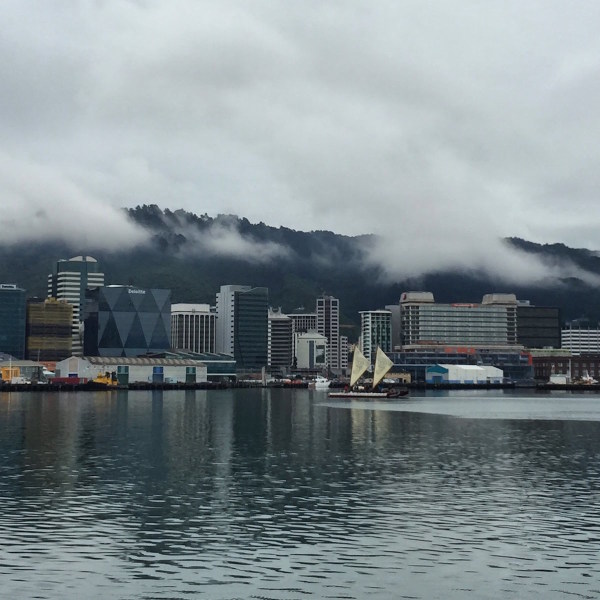 A 'waka' sailing into Wellington on a serenely calm day.