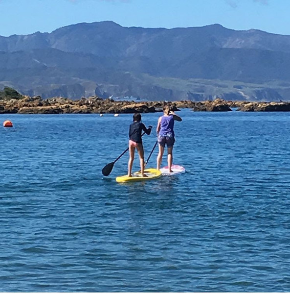 Paddle boarding in Island Bay with my daughter, Sophie.