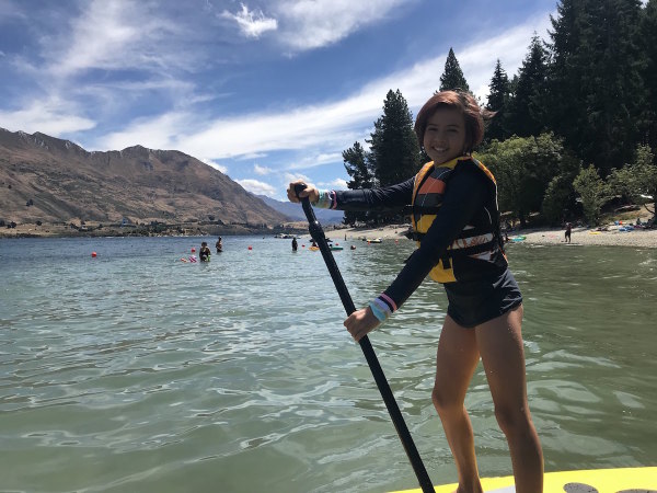 Sophie paddle boarding on Lake Wanaka