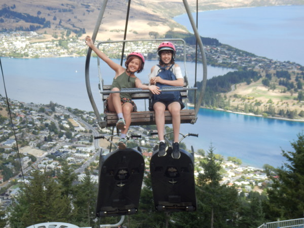 Sophie and Charlotte riding up the chairlift for a luge ride down